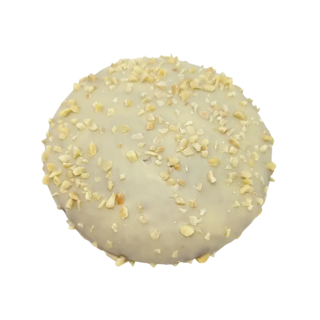 Ein runder Lebkuchen der Bäckerei Wiesender, überzogen mit weißem Zuckerguss und bestreut mit gehackten Nüssen.